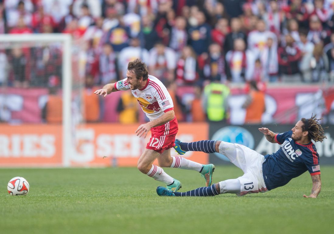 Eric Alexander suffers a crunching tackle from Jermaine Jones.